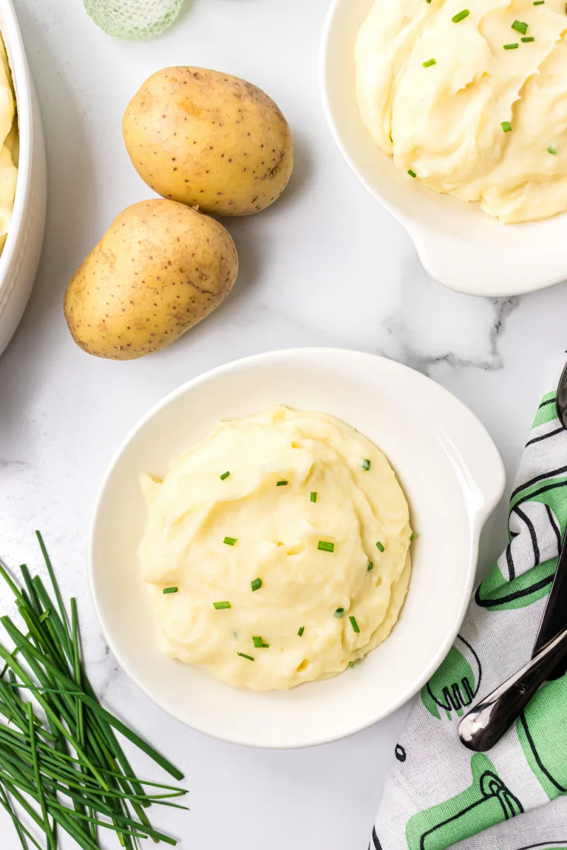 servings of mashed potatoes in white dishes