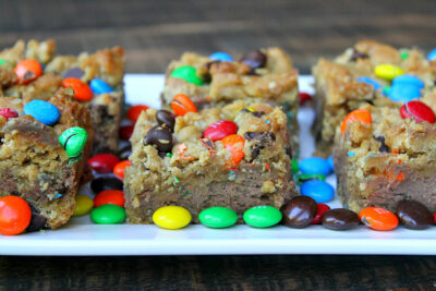 Monster Cookie Chocolate Cheesecake Bars