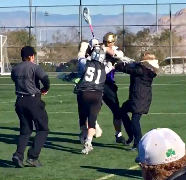 Parent running onto field during lacrosse game