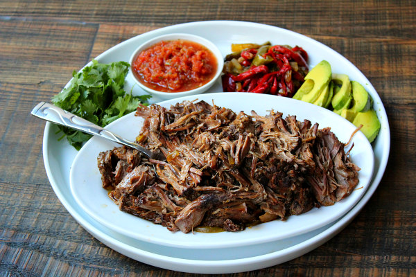 Slow Cooker Steak Fajitas on a plate with fixings