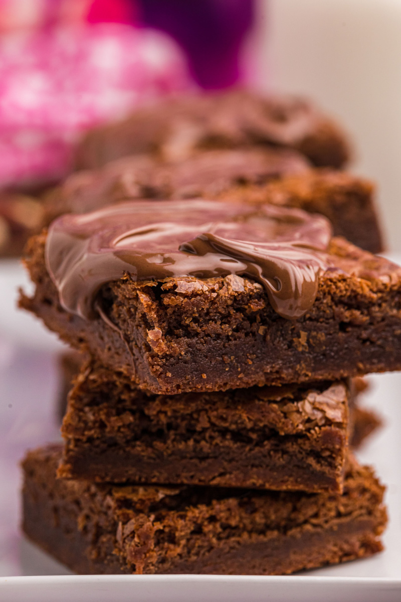 stack of brownies with nutella drizzled on top