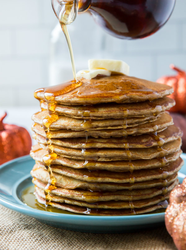 adding syrup to pumpkin pancakes