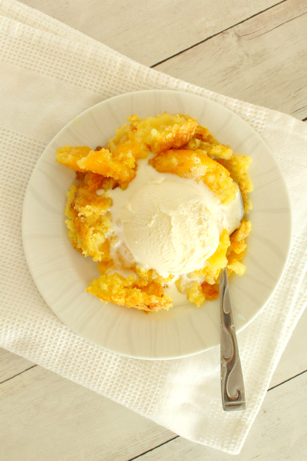 serving of 3 ingredient peach cobbler with ice cream