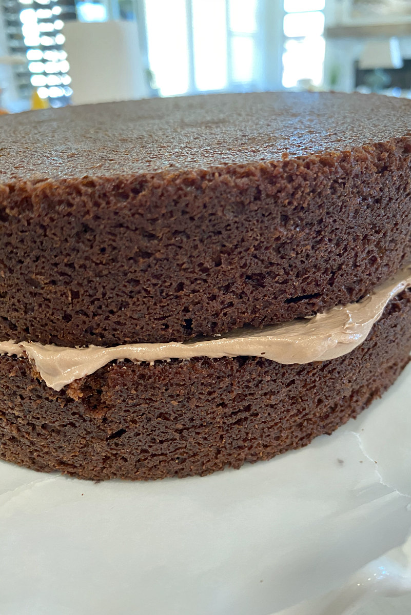 two layers of chocolate cake with a layer of frosting in the middle