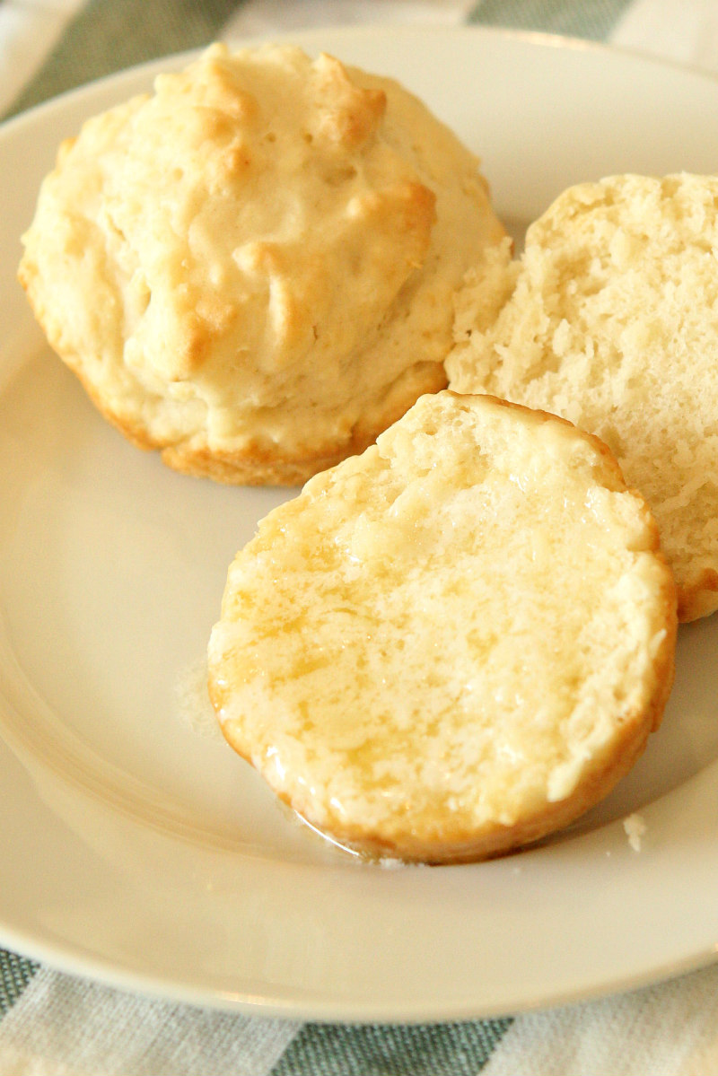 No Yeast Dinner Rolls on a white plate with melted butter