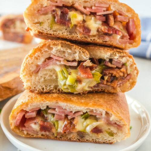 3 stack high of pieces of stromboli on a plate