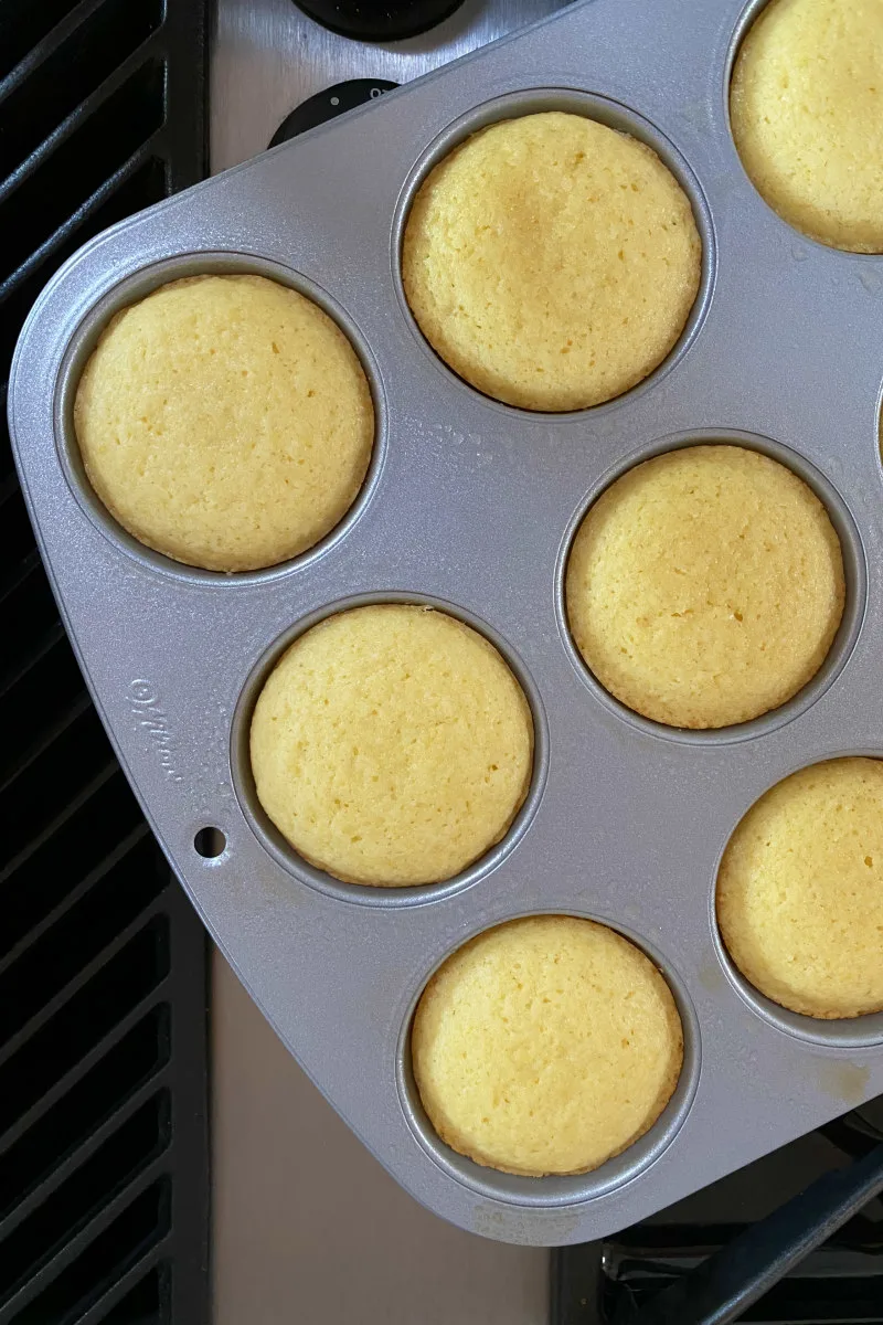 overhead shot of lemon muffins in a muffin pan