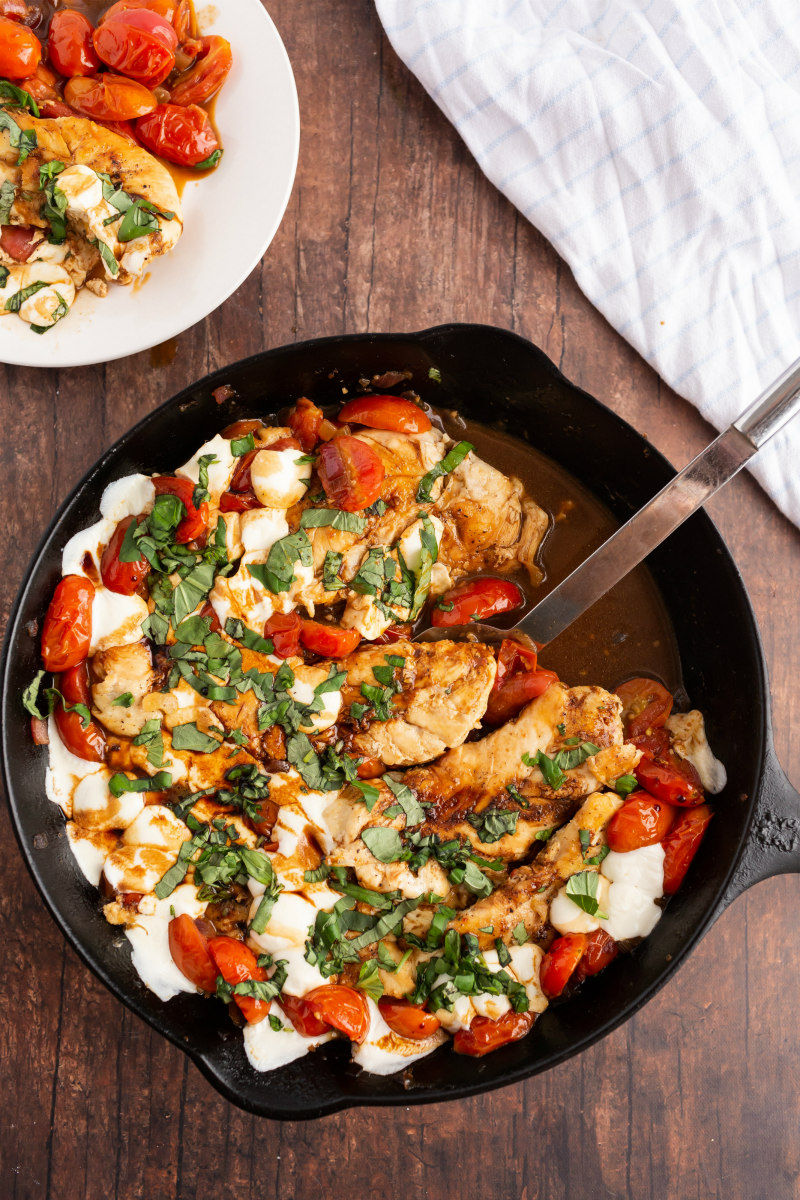 caprese chicken in a black skillet