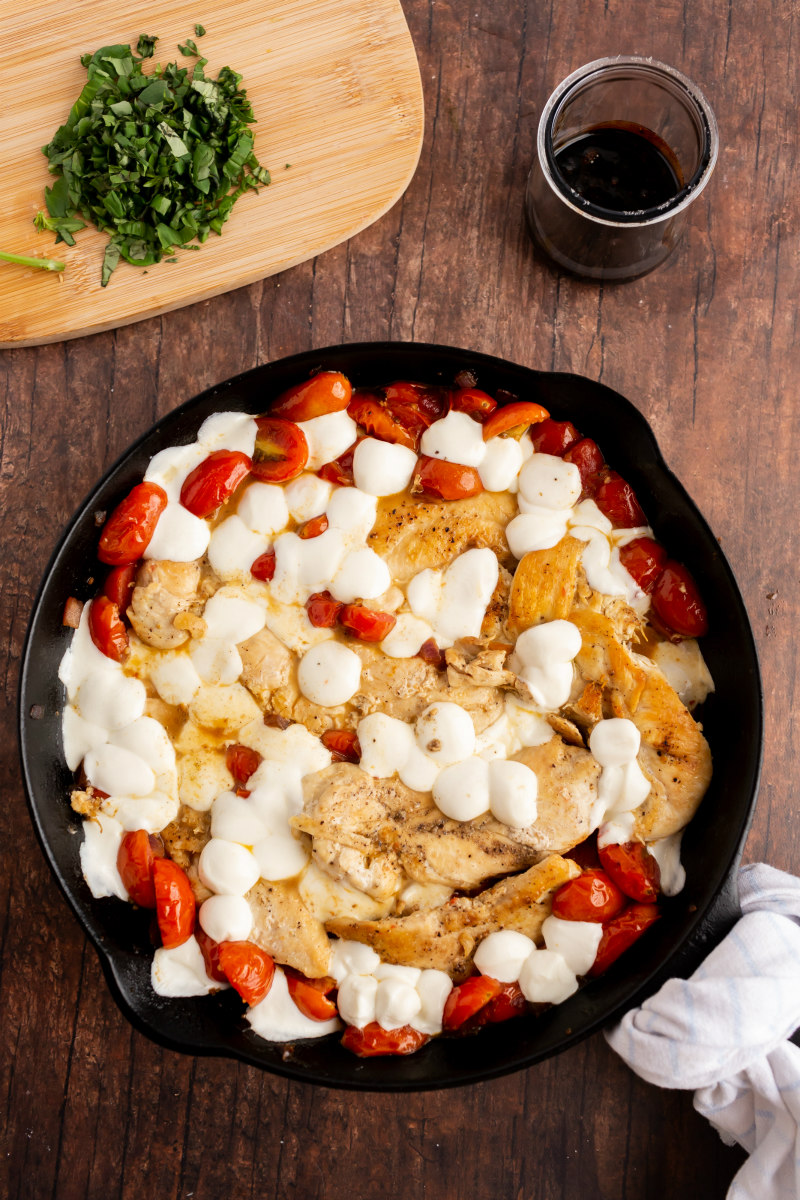 caprese chicken in cast iron skillet