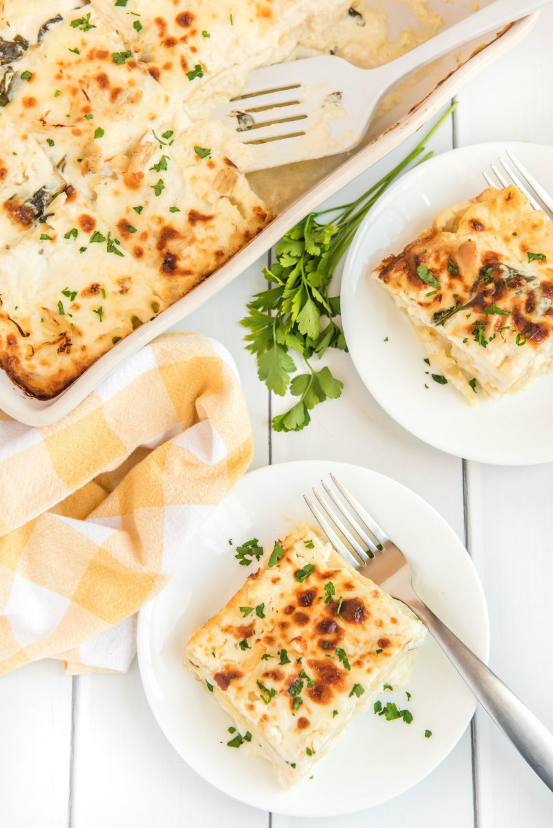 serving lasagna on white plates