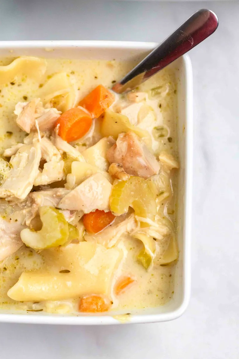 best turkey soup in a white bowl with a spoon