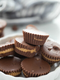 peanut butter cups stacked in white dish
