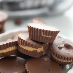 peanut butter cups stacked in white dish