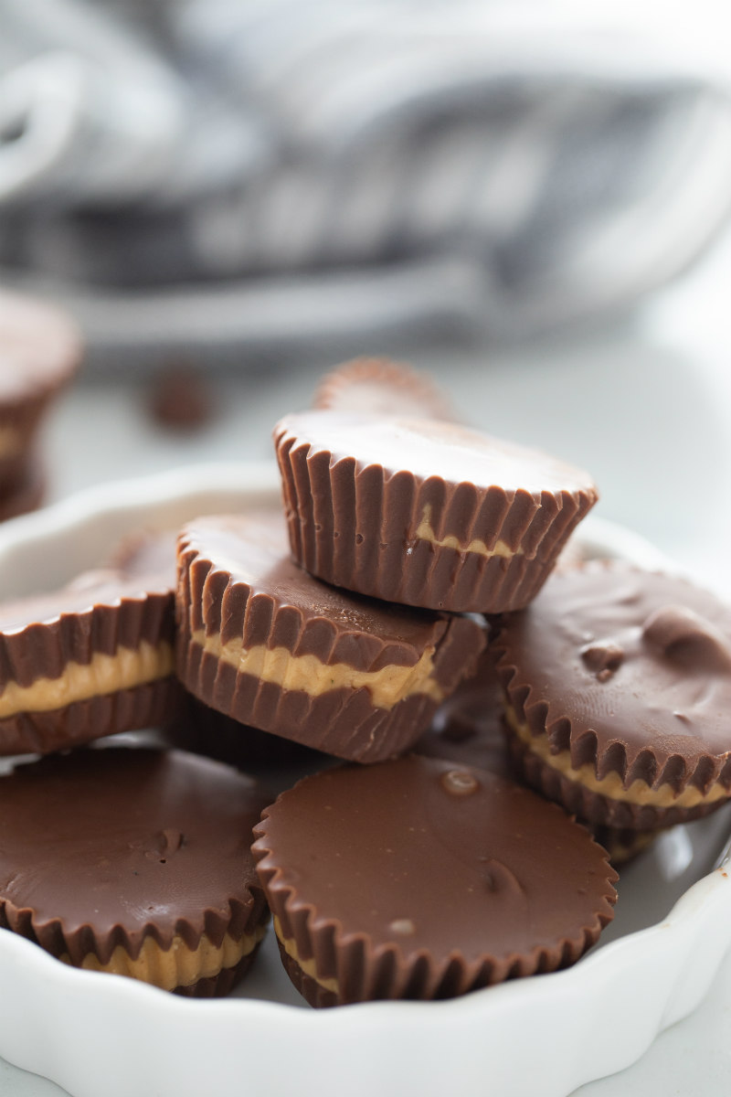 peanut butter cups stacked in white dish