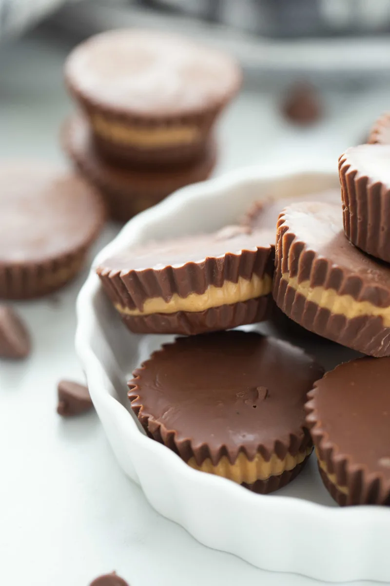 peanut butter cups stacked in white dish