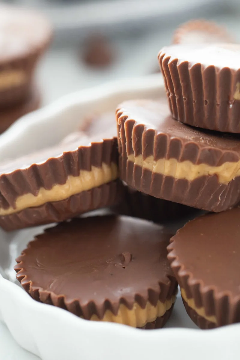 peanut butter cups stacked in white dish