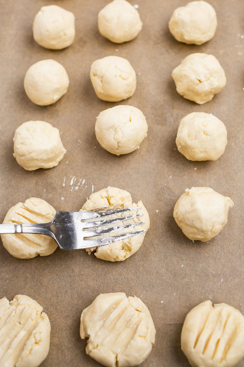 making shortbread cookies with a pressed fork on the cookies