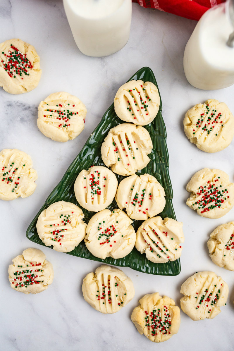 christmas shortbread cookies displayed on a christmas tree plate