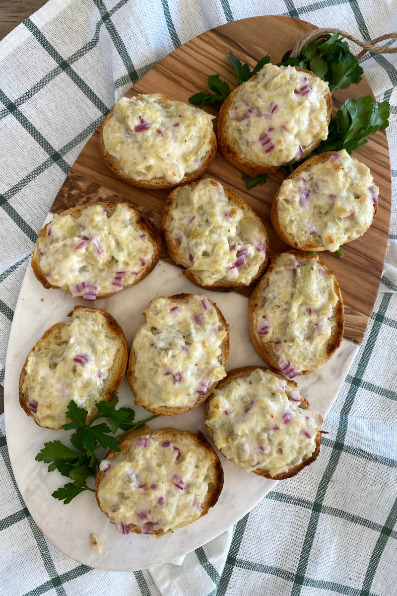 artichoke bruschetta on a board