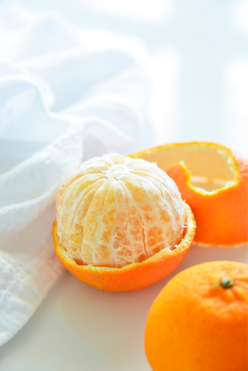 orange half unpeeled