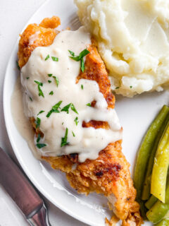 chicken fried chicken with gravy on top