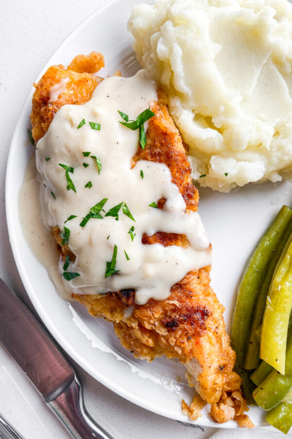 chicken fried chicken with gravy on top