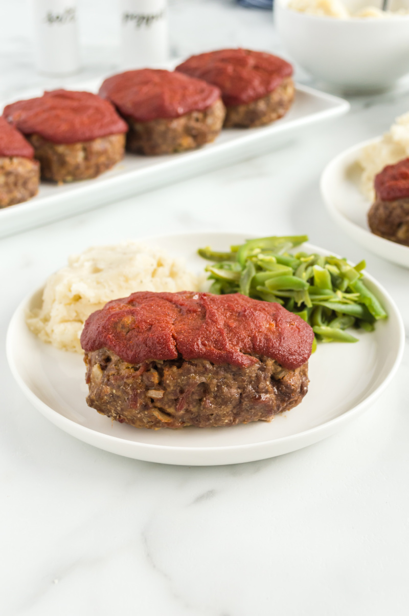 meatloaf on plate with potato and beans