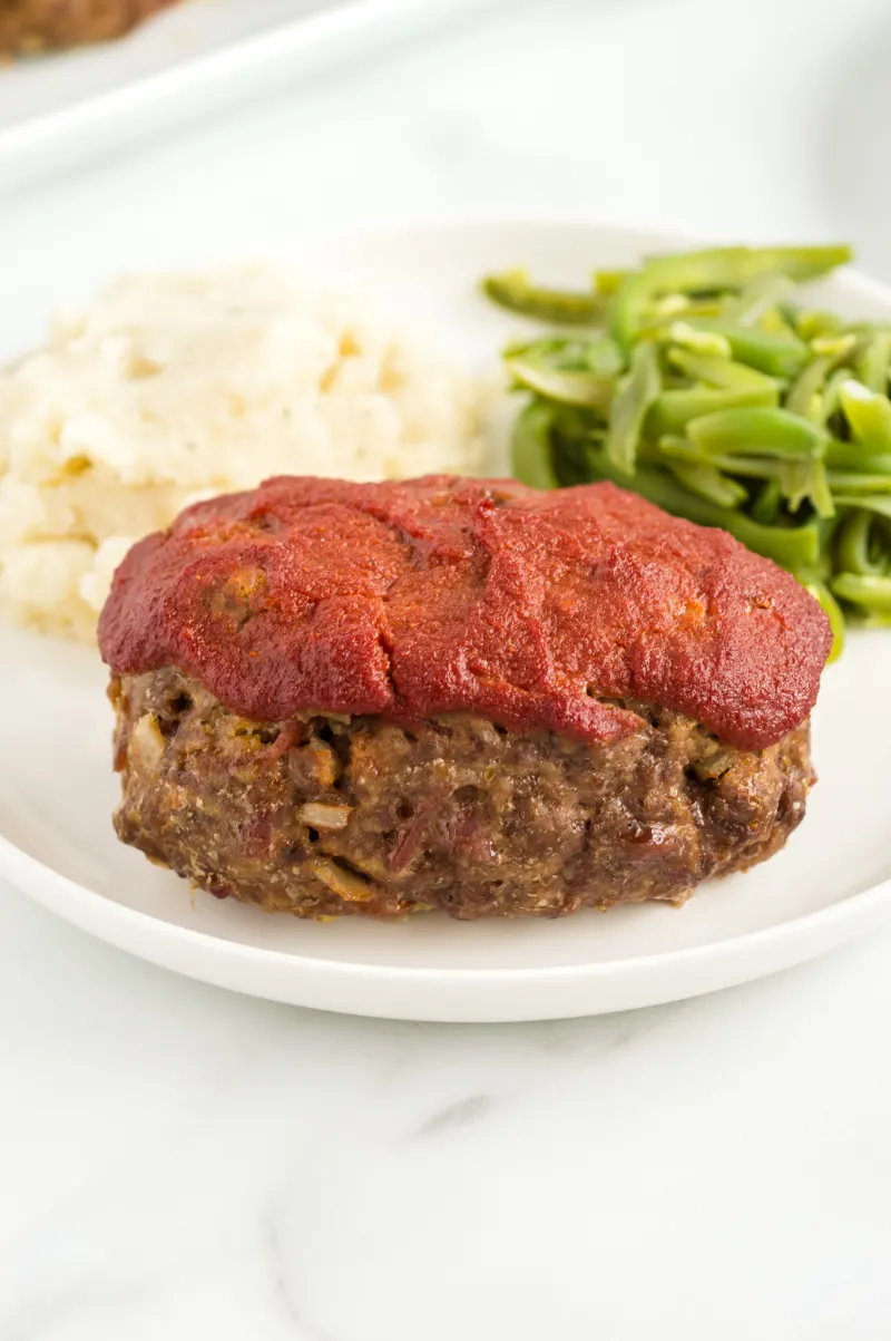 mini meatloaf on plate with potatoes and beans