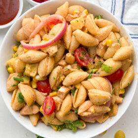 white bowl of BBQ chicken pasta salad