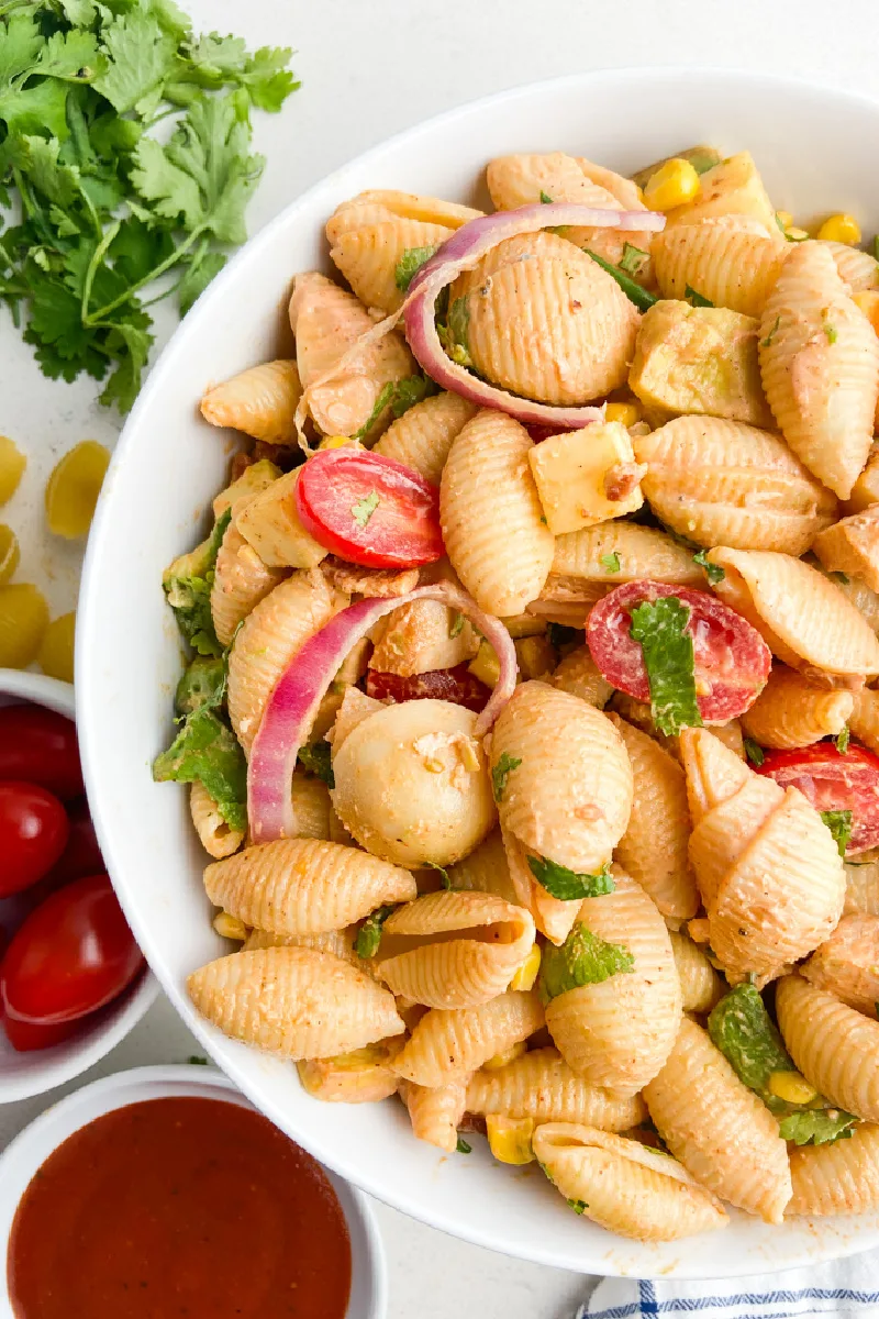 White bowl of BBQ chicken pasta salad