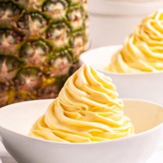 dole whip in a bowl with pineapple in background