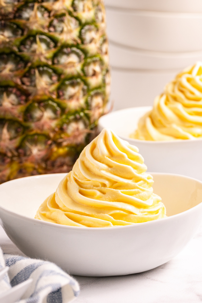 dole whip in a bowl with pineapple in background