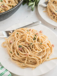 spaghetti carbonara serving on white plate