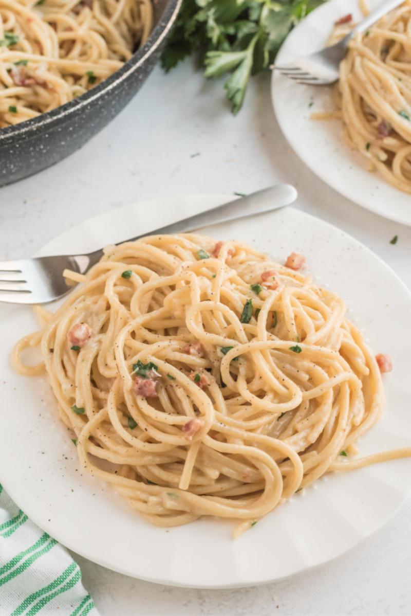 spaghetti carbonara serving on white plate