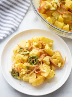 serving of texas potato salad on white plate