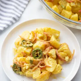 serving of texas potato salad on white plate