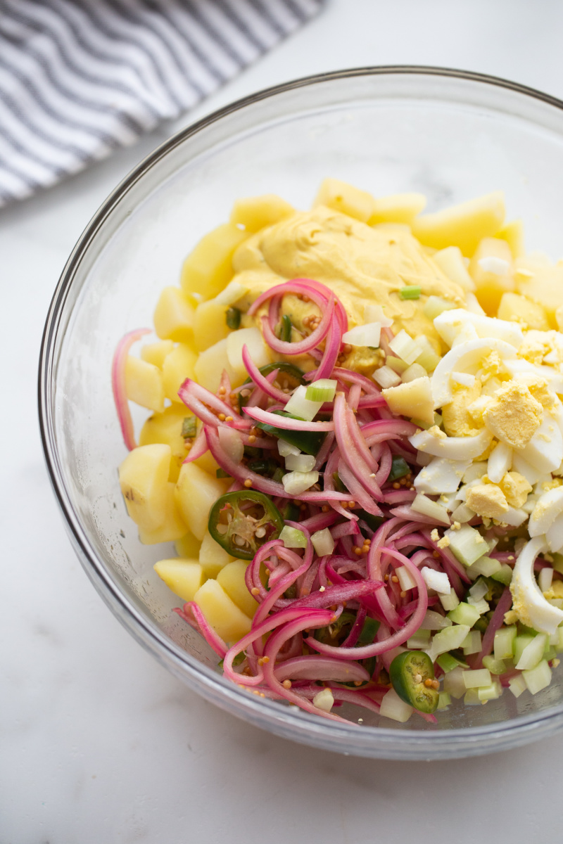 ingredients for texas potato salad in bowl ready to mix