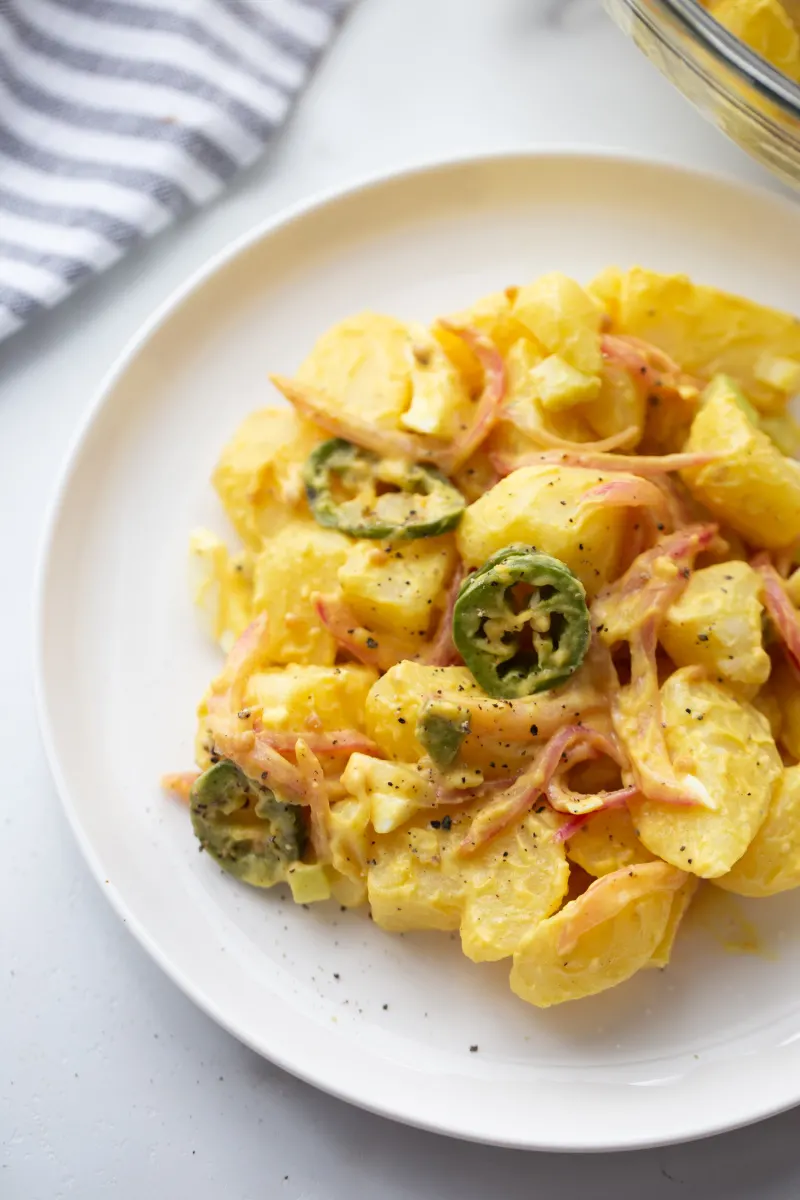 texas potato salad serving on white plate