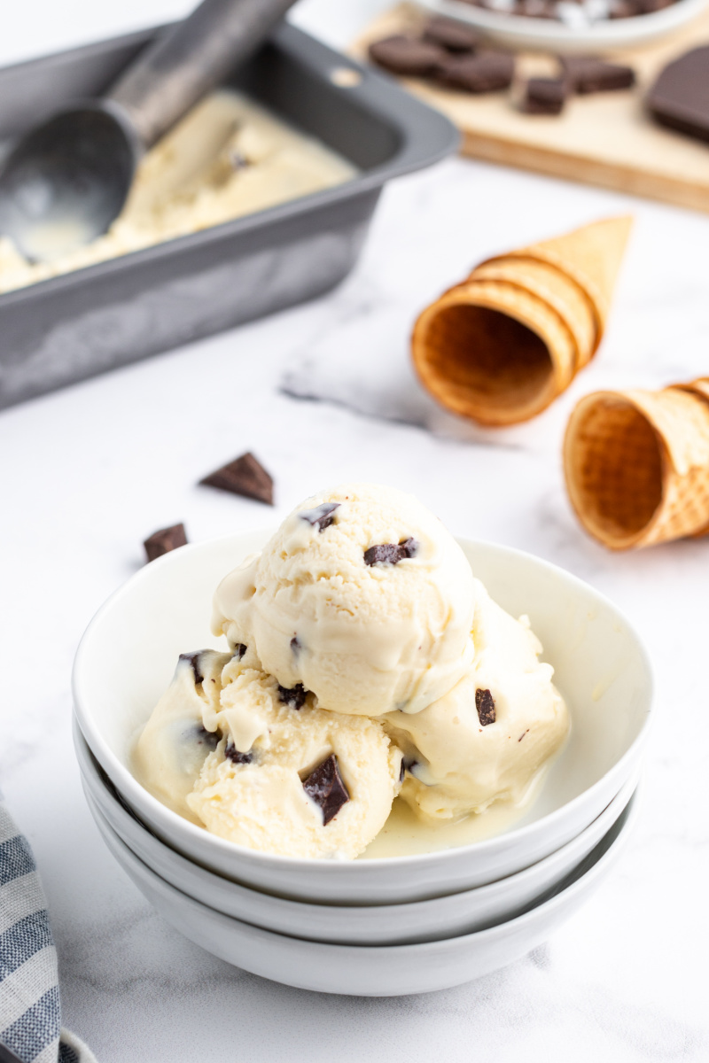 scoops of chocolate chunk gelato in a white bowl