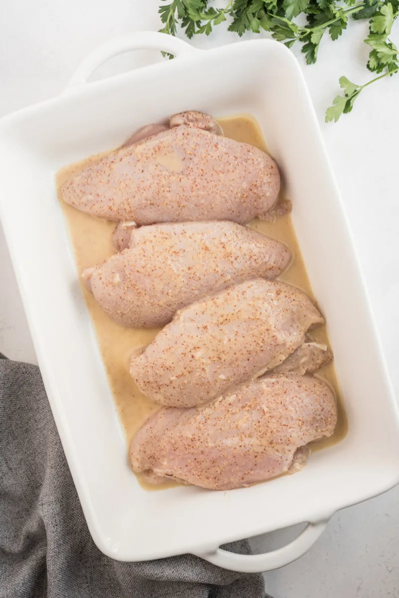 chicken in casserole dish ready for oven