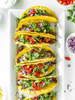 baked ground beef tacos on a platter