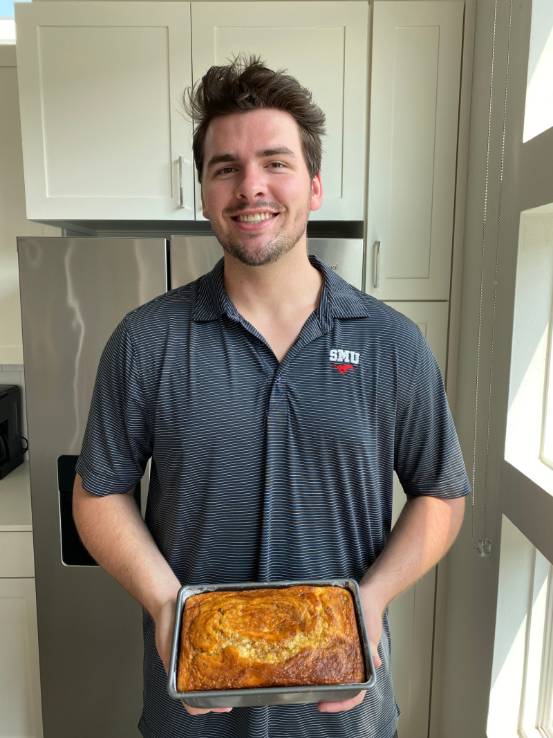 recipeboy holding loaf of pumpkin bread