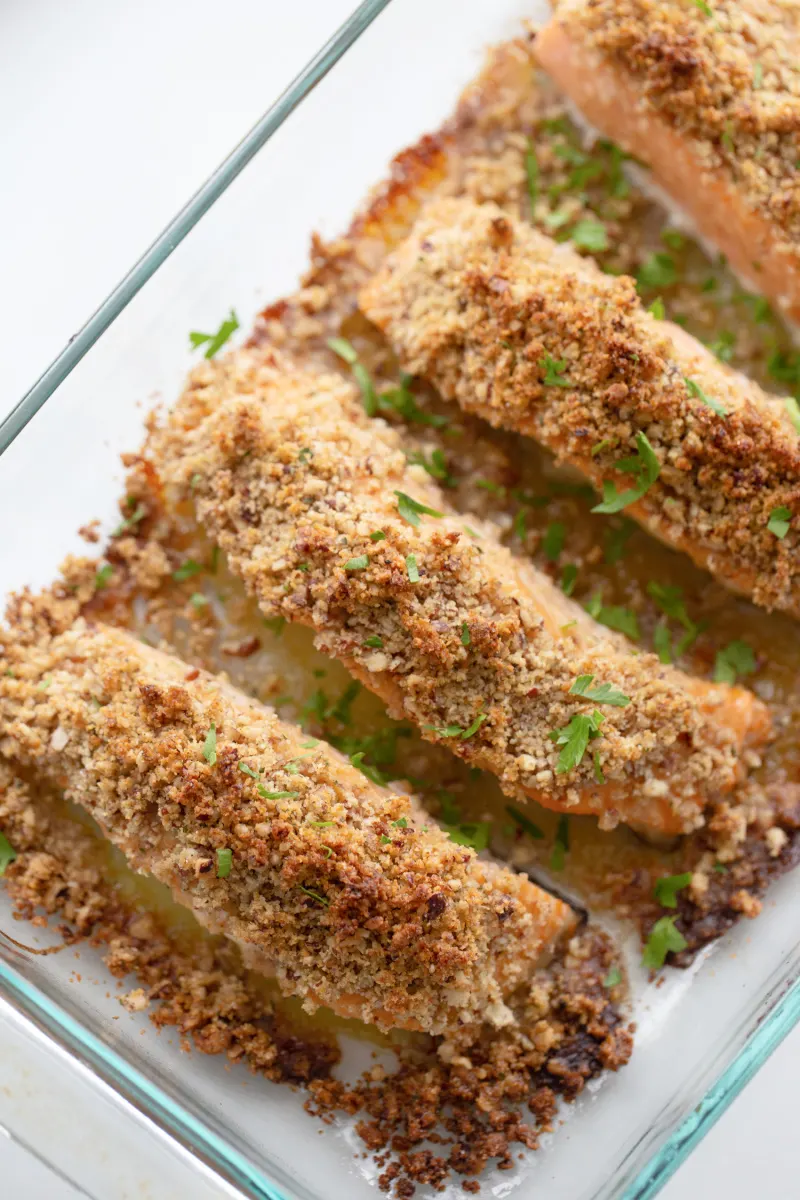 honey dijon and pecan baked salmon in baking dish just out of oven