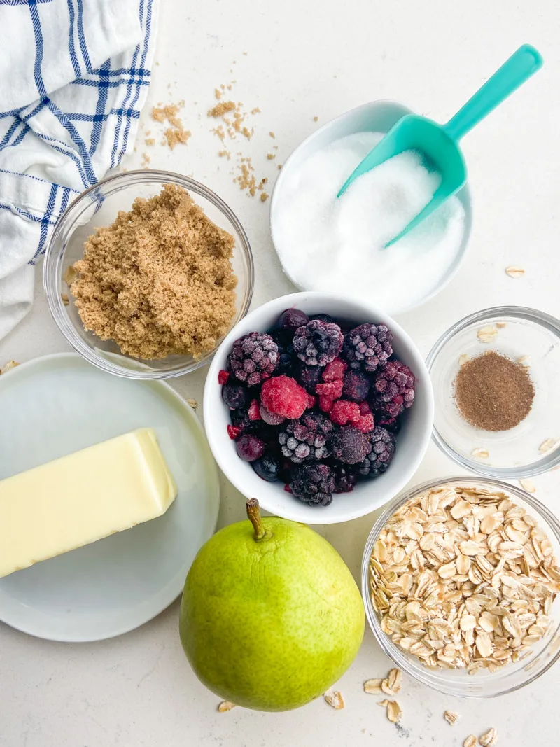 ingredients displayed for making pear and berry crisp