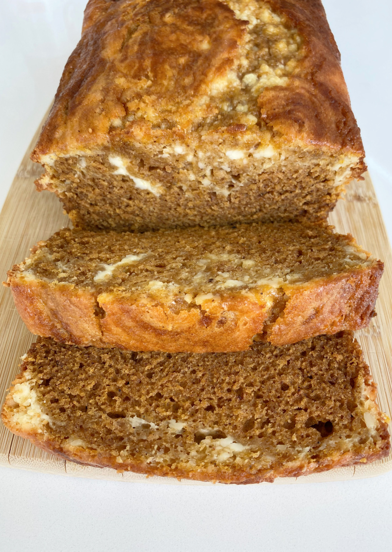 loaf of pumpkin cheesecake bread sliced