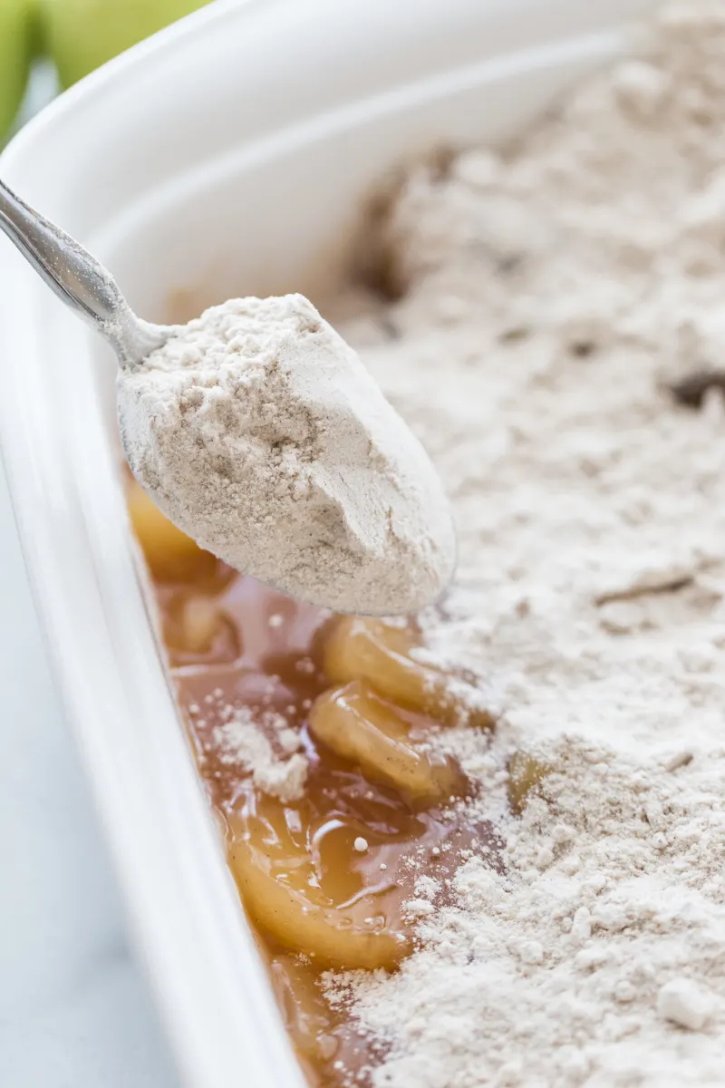 sprinkling cake mix into pan