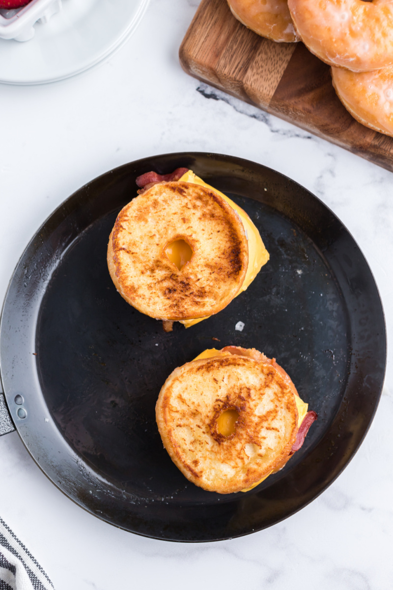 glazed donut grilled cheese cooking in a pan