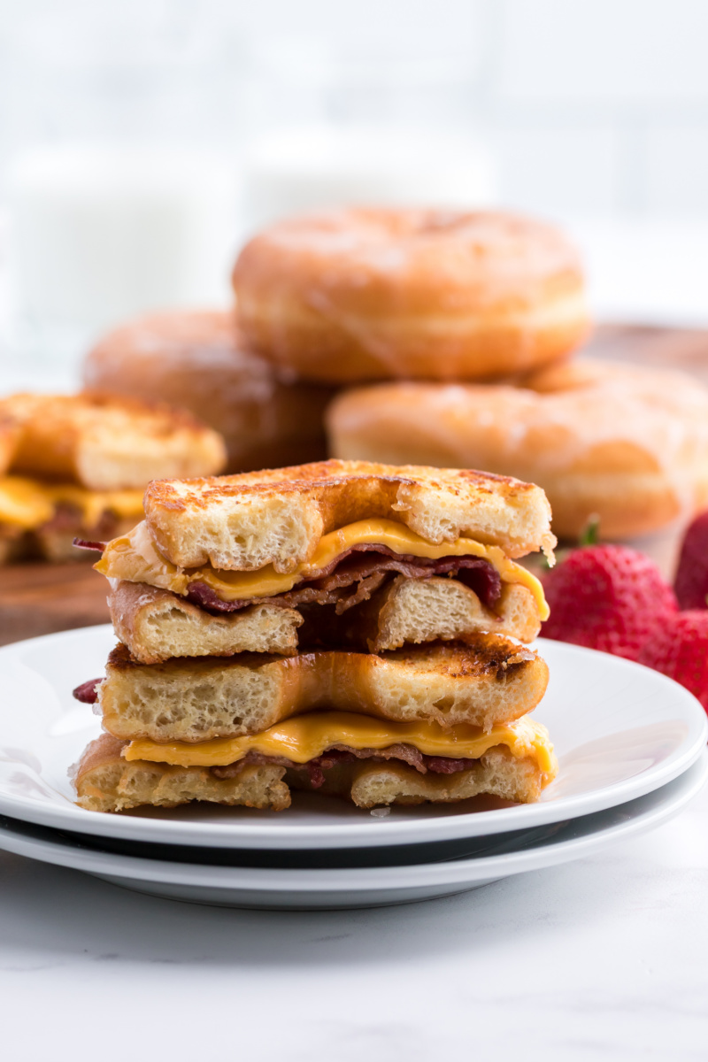 glazed donut grilled cheese cut in half on a plate