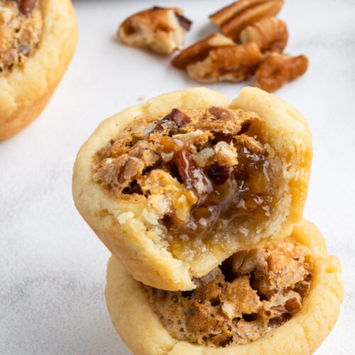 pecan tassies one bite out to show inside.