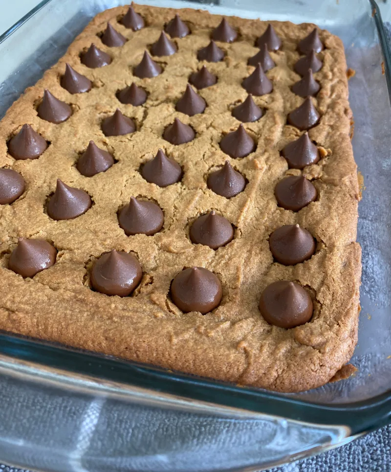 peanut butter blossom bars in the pan